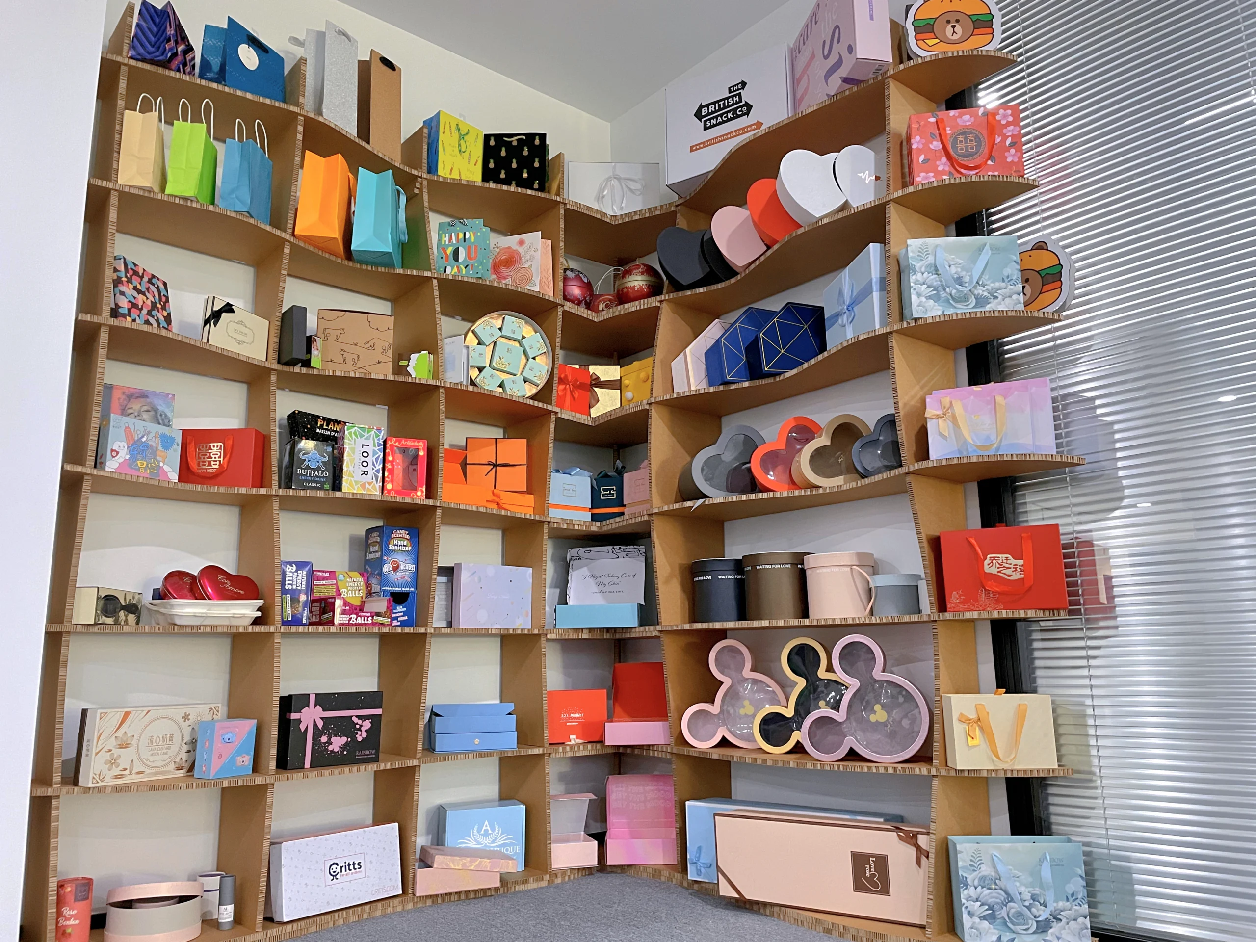 A collection of different types of paper boxes on a shelf