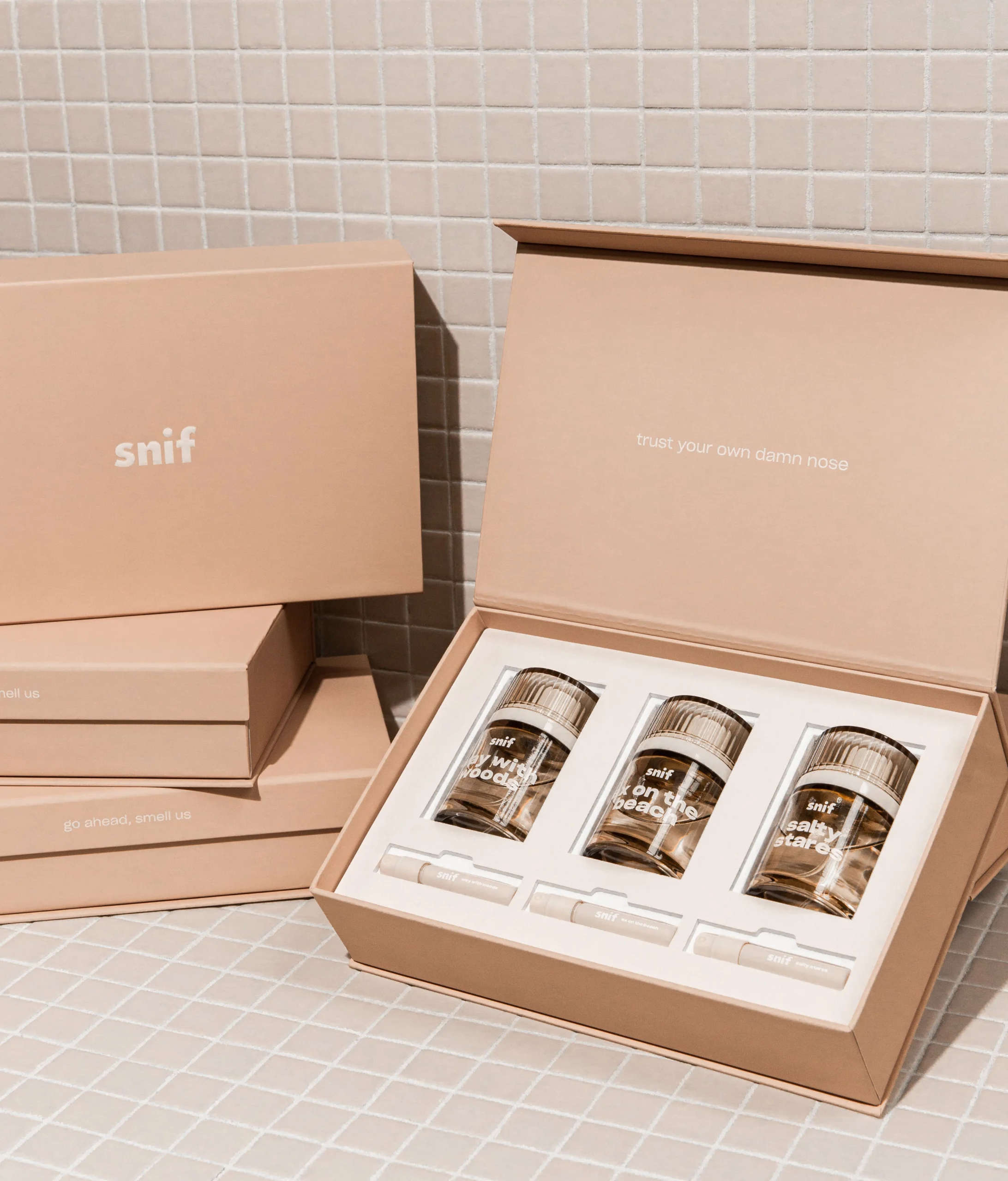 A collection of high-end custom cosmetic boxes showing different printing effects