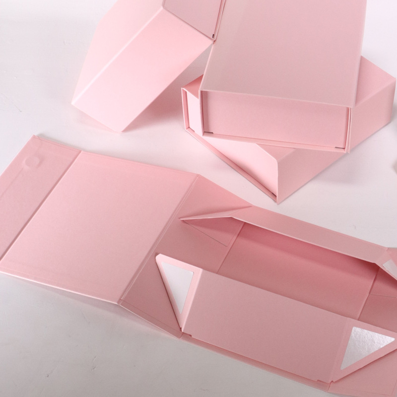 A collapsible rigid box shown flat and then assembled
