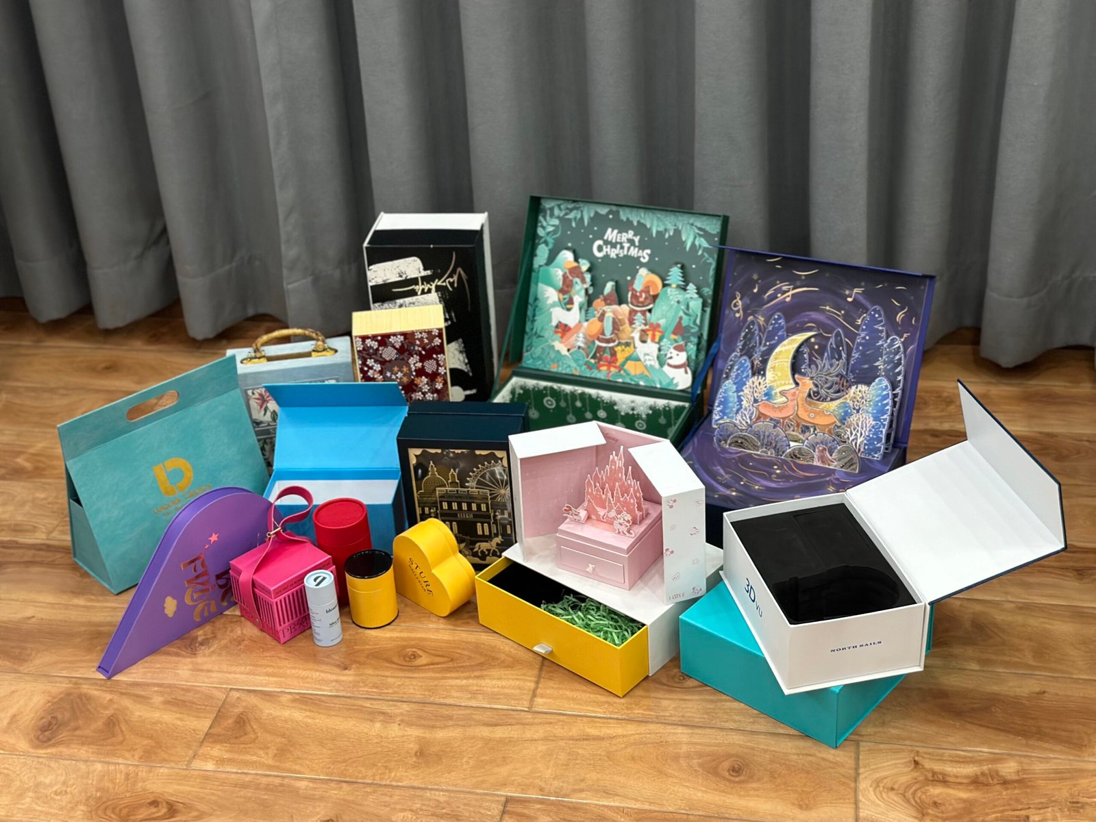 A collection of different custom packaging sample boxes and material swatches