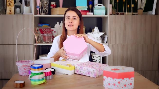 A small business owner packing products in custom boxes