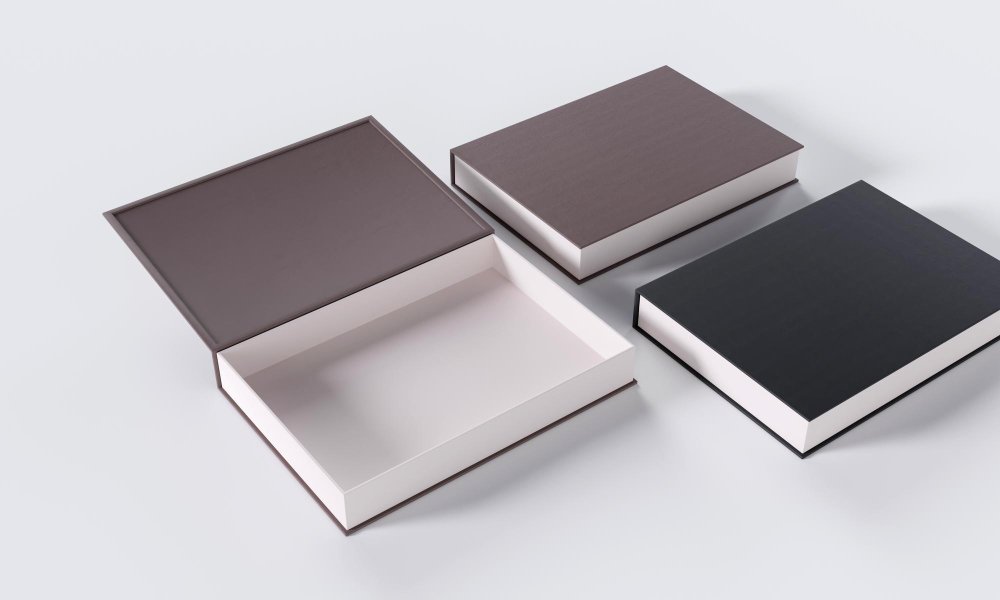 A collection of highly customized book style rigid boxes with different finishes