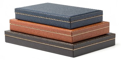 a stack of elegant custom rigid boxes showcasing different colors and finishes