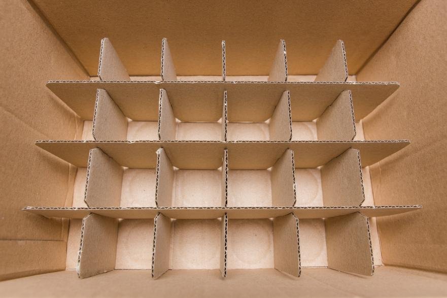a cardboard box with internal dividers and corner supports