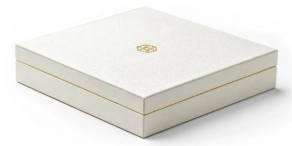 A minimalist white luxury box with a single, subtle gold foil logo in the center.