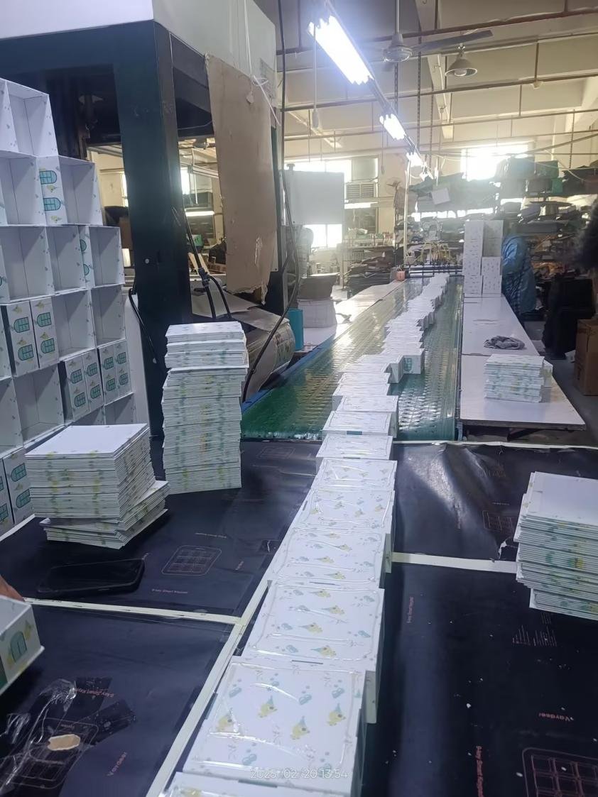 A collection of different custom printed boxes on a factory line