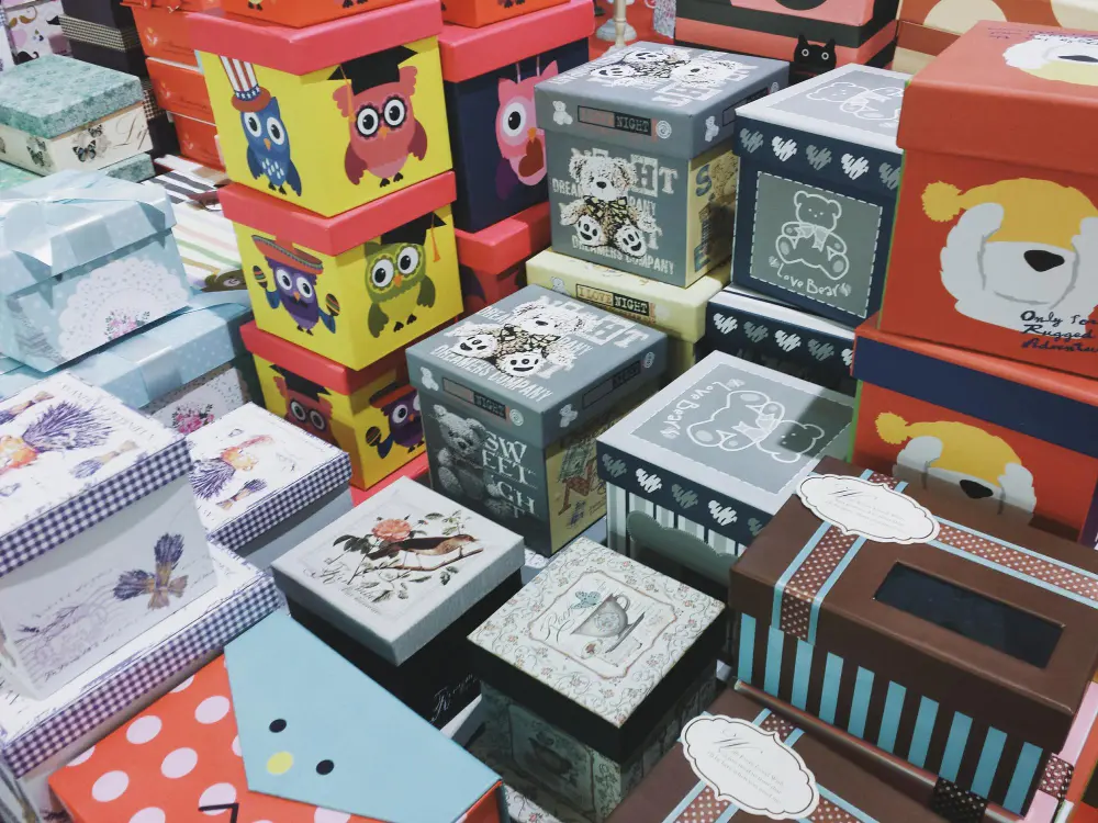 Personalized Digital Printing on Boxes A collection of custom-printed boxes, each with a slightly different design or name, showcasing personalization.