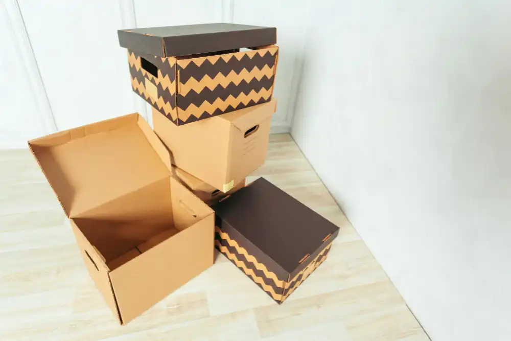 Choosing the Right Packaging Materials for Shoes An array of different packaging materials including corrugated boxes, void fill, and custom tissue paper