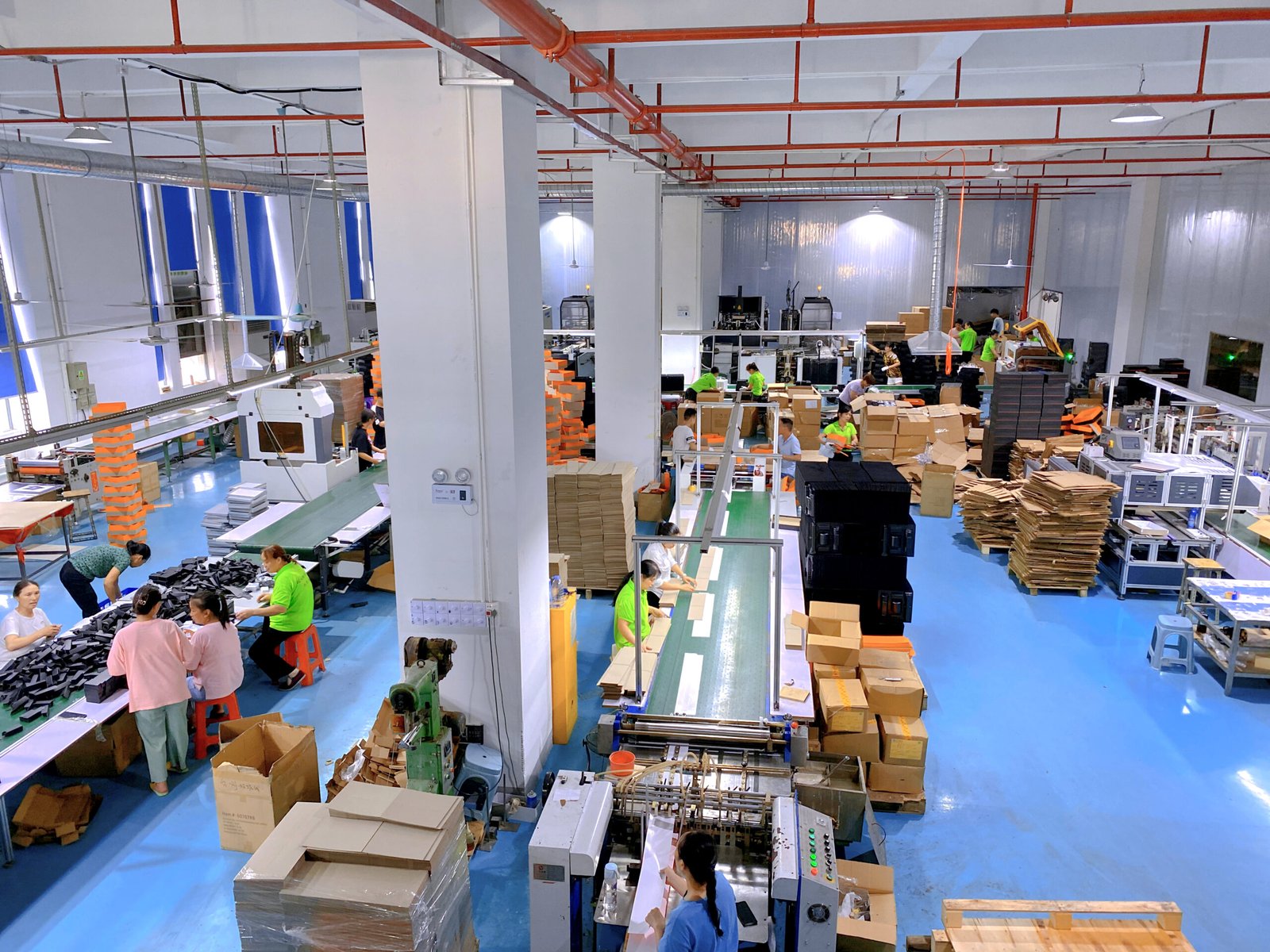 Custom packaging boxes being inspected before shipment from a China packaging factory